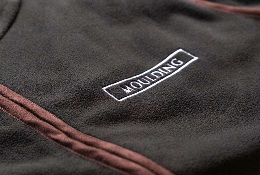 Close-up of an embroidered logo on a fleece