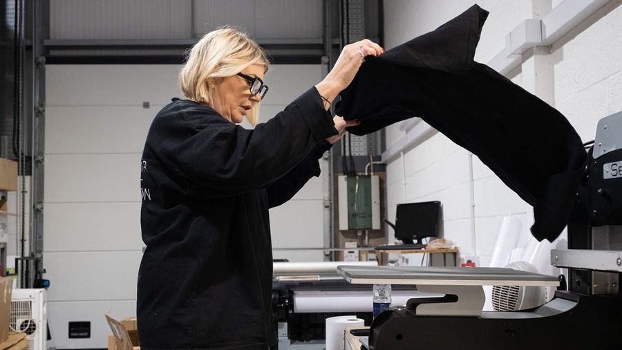 Garment being pressed in the Workwear Innovation workshop